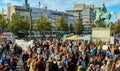 Assembly of many people as protest against climate change on the Schlossplatz with the equestrian statue of Duke August