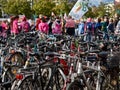 Large group of parked bicycles in front of the protesters against climate change at the FFF