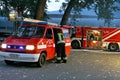 Brave firefighters with the truck and fire hydrants in operation