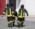 brave firefighters in uniform rescuing the seriously injured person after the accident Royalty Free Stock Photo