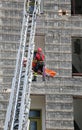 Brave Fireman during an exercise carries the stretcher with the Royalty Free Stock Photo