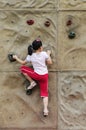 Brave Girl climbing on the wall