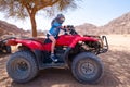 Kid riding quad bike in desert Royalty Free Stock Photo