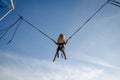 Brave kid jumping high up in skies Royalty Free Stock Photo