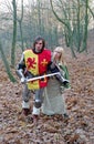 Brave knight and maid in forest