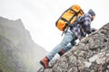 Brave lifestyle man tourist conquers the mountains Royalty Free Stock Photo