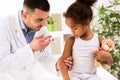 Brave little girl receiving injection Royalty Free Stock Photo