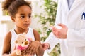 Brave little girl receiving injection Royalty Free Stock Photo