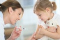 Brave little girl receiving injection by doctor