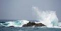 Brave waves hitting rocks