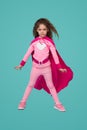 Brave superhero girl in pink costume Royalty Free Stock Photo