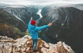 Brave traveler man raised hands traveling in Norway