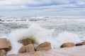 Brave waves of the Adriatic sea beating against the breakwater of the seafront in Bari, Italy