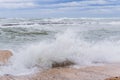 Brave waves of the Adriatic sea beating against the breakwater of the seafront in Bari, Italy