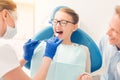 Positive minded teen girl attending dentist Royalty Free Stock Photo