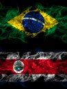 Brazil, Brazilian vs Costa Rica, coat smoky mystic flags placed side by side. Thick colored silky abstract smoke flags