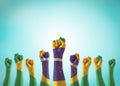 Brazil flag on people hands with clenched fists raising up for labor day, republic proclamation day, national holiday celebration