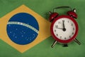 Brazil flag and vintage alarm clock. Time to travel to Brazil Royalty Free Stock Photo