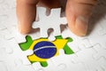 Brazil flag among white puzzle pieces Royalty Free Stock Photo