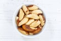 Brazil nut nuts from above bowl wooden board Royalty Free Stock Photo