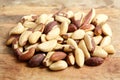 Brazil nuts on wooden background. Shelled brazil nuts Royalty Free Stock Photo