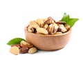 Brazil nuts in wooden bowl on white