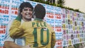 Mural depicting Brazilian soccer legend Pele embracing late Argentinean soccer star Diego Maradona