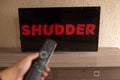 Brazil, Rio de Janeiro - May 19, 2023: In this photo illustration, the Shudder logo tv stream in the background on tv Royalty Free Stock Photo