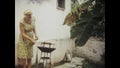 Brazil 1969, 1960s elderly couple barbecuing