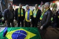 The Brazilian ambassador to Palestine, Francisco Mauro Uland Brasil, watches the Brazil national team match against Switzerland