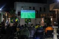 The Brazilian ambassador to Palestine, Francisco Mauro Uland Brasil, watches the Brazil national team match against Switzerland