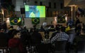 The Brazilian ambassador to Palestine, Francisco Mauro Uland Brasil, watches the Brazil national team match against Switzerland