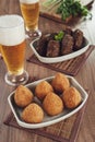 Deep fried brazilian snacks coxinha de frango with beer Royalty Free Stock Photo