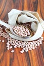 Brazilian bean. Carioca grains in a jute fabric on the rustic table Royalty Free Stock Photo