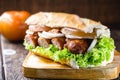 Brazilian beef sandwich, sausage, tomato, lettuce and onion in a salt bread