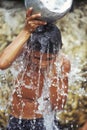 Brazilian boy taking a shower in Amazonia.