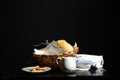Brazilian breakfast on the dark background. Milk, basket of breads and cookies. Royalty Free Stock Photo