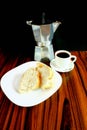 Brazilian breakfast dark photo. Bread and black coffee. Brazil tradition