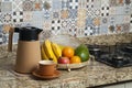 Brazilian breakfast. Breakfast table with coffee thermos, cup and fruits in the basket