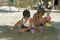 Brazilian children playing with toy trucks