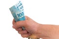 Brazilian currency, high nominal squeezed in handful Royalty Free Stock Photo