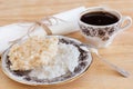 Brazilian dessert Coconut candy cocada on plate with cup of coffee Royalty Free Stock Photo