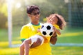 Brazilian father and son play football. Go Brazil