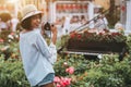 Brazilian female with retro cam and flowers with piano behind