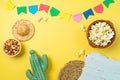 Brazilian Festa Junina party background with popcorn, peanuts, cactus and colorful banners. Top view from above Royalty Free Stock Photo