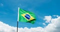 Brazilian flag waving against blue sky Royalty Free Stock Photo