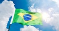 Brazilian flag waving against blue sky Royalty Free Stock Photo