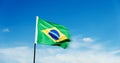 Brazilian flag waving against blue sky Royalty Free Stock Photo