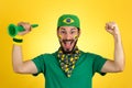 Brazilian supporter of National football team is celebrating, ch Royalty Free Stock Photo