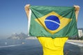 Brazilian Football Player Holding Flag at the Sea